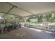 Screened porch with backyard view, bikes, table and chairs at 5456 Nw 64Th St, Ocala, FL 34482