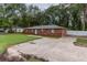 Brick home with driveway and large front yard at 5456 Nw 64Th St, Ocala, FL 34482