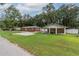Brick home with carport and fenced backyard at 5456 Nw 64Th St, Ocala, FL 34482