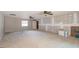 Spacious bonus room with ceiling fans, window, and under-renovation wall at 5456 Nw 64Th St, Ocala, FL 34482