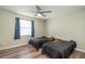 Bedroom with two twin beds, window, and ceiling fan at 5456 Nw 64Th St, Ocala, FL 34482