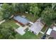 Aerial view showing a brick home, detached garage, and large yard at 5456 Nw 64Th St, Ocala, FL 34482