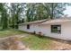Side view of a single-story house with a small patio at 5456 Nw 64Th St, Ocala, FL 34482