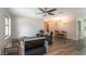 Open living and dining area with seating, table, and ceiling fan at 5456 Nw 64Th St, Ocala, FL 34482