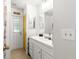 Clean bathroom with white vanity and a door to outside at 4980 Sw 195Th Ave, Dunnellon, FL 34431