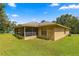 House with a screened patio and a large grassy area at 4980 Sw 195Th Ave, Dunnellon, FL 34431