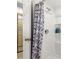 Small bathroom with a shower and built-in shelving at 4980 Sw 195Th Ave, Dunnellon, FL 34431