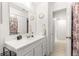Bright bathroom with white vanity and a large mirror at 4980 Sw 195Th Ave, Dunnellon, FL 34431