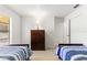 Bedroom with two twin-size beds and a dresser at 4980 Sw 195Th Ave, Dunnellon, FL 34431