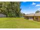 Large backyard with green grass and mature trees at 4980 Sw 195Th Ave, Dunnellon, FL 34431