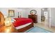 Main bedroom with a comfortable bed and ensuite bathroom at 4980 Sw 195Th Ave, Dunnellon, FL 34431