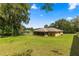 House with a large backyard and green grass at 4980 Sw 195Th Ave, Dunnellon, FL 34431