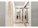 Long hallway with mirrored closet doors and built-in storage at 4980 Sw 195Th Ave, Dunnellon, FL 34431