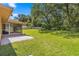 Spacious backyard with screened patio and lush lawn at 4980 Sw 195Th Ave, Dunnellon, FL 34431