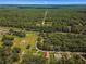 Aerial view showing home's location in a wooded neighborhood at 4980 Sw 195Th Ave, Dunnellon, FL 34431