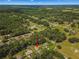 An aerial view showing the home's setting in a residential neighborhood at 4980 Sw 195Th Ave, Dunnellon, FL 34431