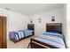 Bright bedroom with two twin beds and wood frames at 4980 Sw 195Th Ave, Dunnellon, FL 34431