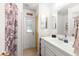 Clean bathroom with white vanity and a door to outside at 4980 Sw 195Th Ave, Dunnellon, FL 34431