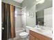 Simple bathroom with shower/tub combo and wood vanity at 9882 Sw 89Th Lane Rd, Ocala, FL 34481