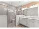 Bathroom with double vanity, large shower, and gray tile at 7867 Sw 74Th Loop, Ocala, FL 34481
