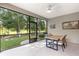 Screened patio with table and chairs, overlooking the backyard at 7867 Sw 74Th Loop, Ocala, FL 34481
