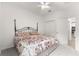 Spacious bedroom with carpeted floors, a large bed, and an en-suite bathroom at 7867 Sw 74Th Loop, Ocala, FL 34481