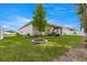 Spacious backyard with a covered patio and lush lawn at 7867 Sw 74Th Loop, Ocala, FL 34481