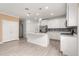 Open concept kitchen with island and stainless steel appliances at 7867 Sw 74Th Loop, Ocala, FL 34481