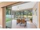 Screened patio with outdoor seating and backyard view at 7867 Sw 74Th Loop, Ocala, FL 34481