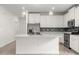 Modern kitchen with white cabinets and island at 7867 Sw 74Th Loop, Ocala, FL 34481