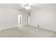 Main bedroom with carpet and access to bathroom at 7867 Sw 74Th Loop, Ocala, FL 34481