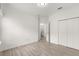 Bedroom with tile floor, private bath access, and double doors to closet at 7867 Sw 74Th Loop, Ocala, FL 34481