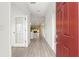 Bright entry hall with tile flooring and views into the living areas at 7867 Sw 74Th Loop, Ocala, FL 34481