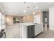 Open concept kitchen with island and view into living room at 7867 Sw 74Th Loop, Ocala, FL 34481