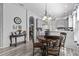Bright dining area with wood table and chairs near kitchen at 12333 Se 177Th Loop, Summerfield, FL 34491