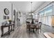Kitchen dining area with wood table and chairs, view into kitchen at 12333 Se 177Th Loop, Summerfield, FL 34491