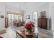 Bright dining room with hardwood floors, chandelier, and views to kitchen at 12333 Se 177Th Loop, Summerfield, FL 34491