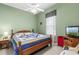 Cozy bedroom with a queen-size bed and wood furniture at 12333 Se 177Th Loop, Summerfield, FL 34491