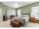 Main bedroom with a king-size bed and relaxing color scheme at 12333 Se 177Th Loop, Summerfield, FL 34491