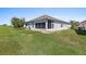 House exterior view, highlighting the screened patio at 12333 Se 177Th Loop, Summerfield, FL 34491
