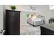 Spacious bedroom with ceiling fan and large window at 9357 Sw 82Nd Ter # B, Ocala, FL 34481