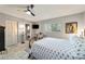 Comfortable bedroom with a ceiling fan and en-suite bathroom at 9357 Sw 82Nd Ter # B, Ocala, FL 34481