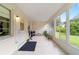 Sunroom with tiled floor and backyard access at 9357 Sw 82Nd Ter # B, Ocala, FL 34481