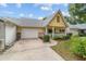 Cute yellow house with a covered porch and well-maintained lawn at 9357 Sw 82Nd Ter # B, Ocala, FL 34481