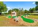 Miniature golf course with a bench and landscaping at 9357 Sw 82Nd Ter # B, Ocala, FL 34481