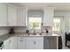 Modern kitchen with granite countertops and double sink at 9357 Sw 82Nd Ter # B, Ocala, FL 34481