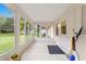 Sunroom with tiled floor and access to backyard at 9357 Sw 82Nd Ter # B, Ocala, FL 34481