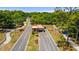 Gated community entrance with landscaped medians and paved roads at 9357 Sw 82Nd Ter # B, Ocala, FL 34481