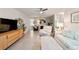 Bright living room with comfy seating, large TV, and fireplace at 9357 Sw 82Nd Ter # B, Ocala, FL 34481