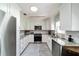 Modern kitchen featuring white cabinets and granite countertops at 9357 Sw 82Nd Ter # B, Ocala, FL 34481